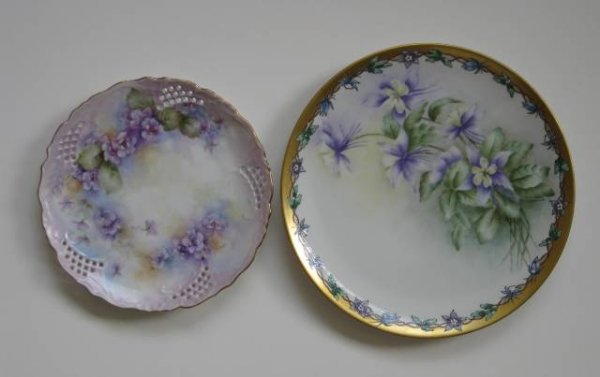 2 hand-painted plates by Helen Litkovitz: 2 hand-painted porcelain plates by Helen Litkovitz decorated with violets with gilt accents, both signed, one dated 1965. 10 1/2'', 8 1/2'' dia.