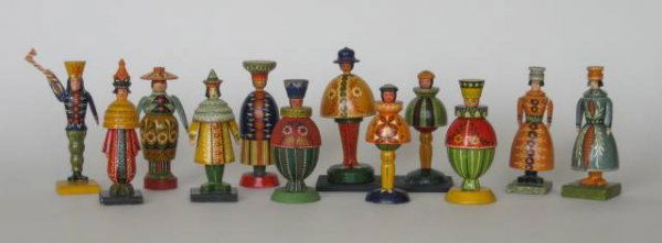 12 Polish painted wood figurines: 12 Polish painted wood figurines, ca. 1900- 3 Women, 3 Pages, 1 Kino, 1 Buffoon, 1 Huckstress, 1 Egg-Shaped Man, 1 Man with Axe and 1 Highlander- each of 1 Page and Highlander nailed to wooden bases,