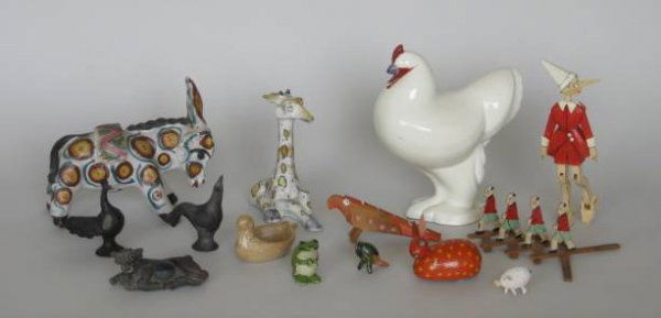 12 small miscellaneous items: 12 small miscellaneous items- 3 ceramic bird whistles; a rabbit wooden pull toy; a pig; a cow; a frog and parrot; a painted wood Pinocchio; a ceramic donkey; a ceramic ashtray; a giraffe, a rooster- t
