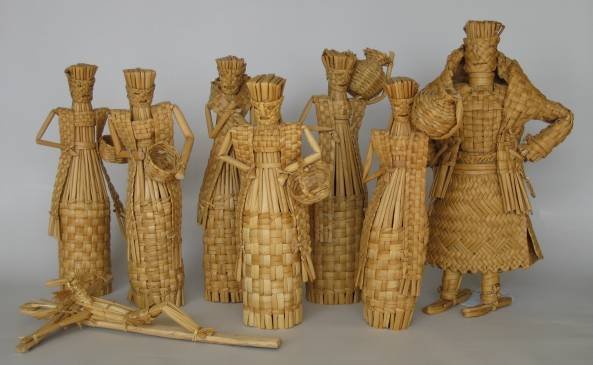8 Mexican items: 6 20th c. Mexican tule bottle covers in the shape of figures, along with a large figure made of reed, and a Crucifix made of straw, very good condition. various sizes