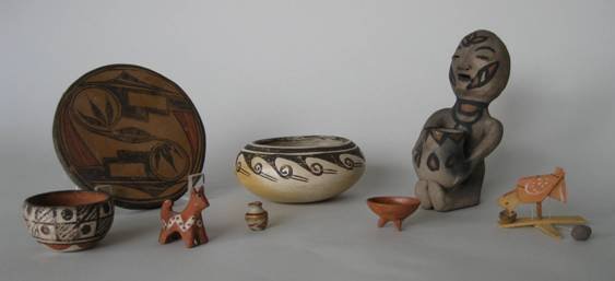 4 Native North American items: 4 Native North American items- 2 pottery bowls, 1 rain god figure and 1 circular plaque; along with Mexican miniature tripod bowl, jar, dog and wooden bird peck toy fair condition, various sizes.
