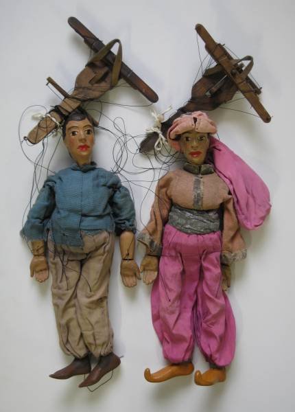 2 Young male marionettes: 2 20th c. Young male marionettes, some wear with scratches, nicks and cracks, fair condition. 20''l, 21''l