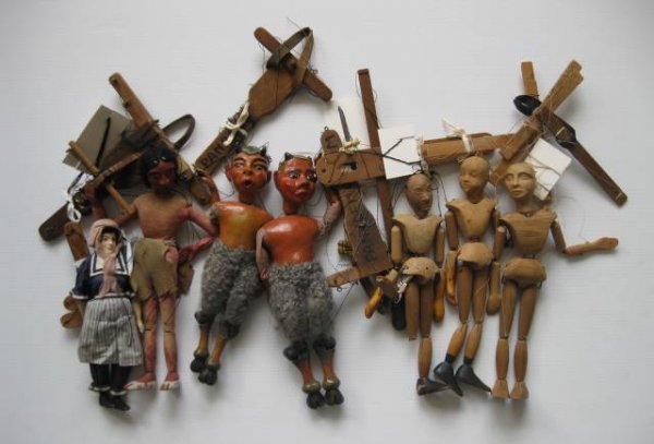 7 Marionettes: 7 20th c. Marionettes- 3 master marionnets, 2 devils, 1 female in bonnet, and 1 male in loin cloth, some wear, strings tangled, 1 master marionette has part of leg detached, fair condition. various si