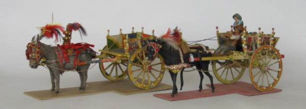 2 Early 20th c. carts: 2 Early 20th c. carts- 1 Sicilian toy cart with donkey and 1 model pony cart along with 3 figures and barrel, good condition. toy cart 6'', pony cart 7''