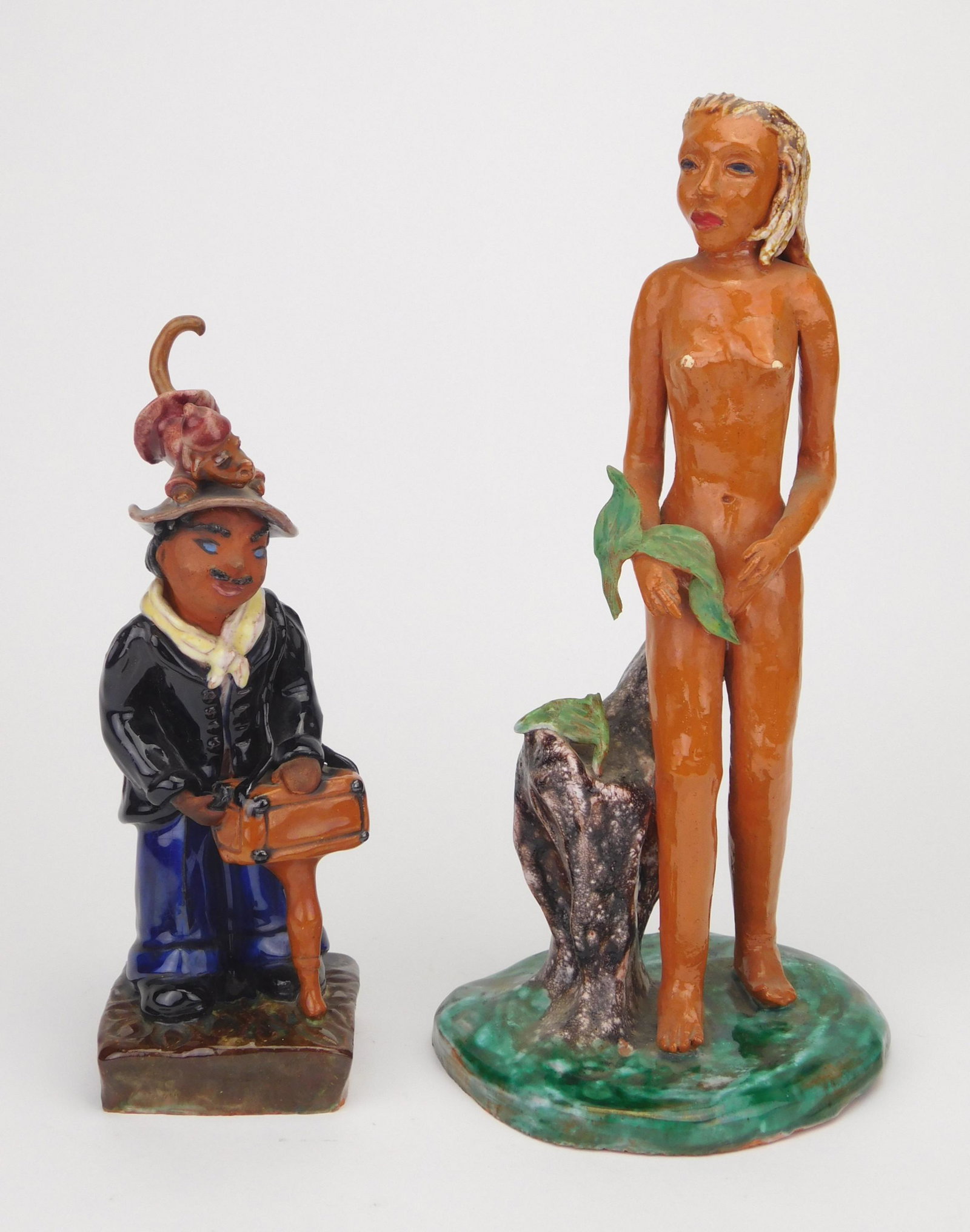 2 Dorothy S. Harkins ceramic sculptures: Dorothy Harkins (American 1906- ?) 1). ''Eve''- ceramic sculpture, signed Harkins at bottom, several chips. 11 1/2''h 2). ''Organ Grinder''- ceramic sculpture, signed Harkins on back at base. 9''h