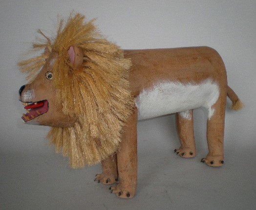 David Alvarez wood sculpture: David Alvarez (American 20th c.)- Lion- painted wood sculpture, ca. 1980's, straw mane and tail, signed on bottom. 16''h, 28''l