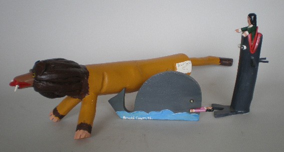 Ronald Cooper 3 wood sculptures: Ronald Cooper (American 1931- )- Lion; Jonah and The Whale (2)- 3 painted wood sculptures, 1998, all signed and dated. 7 1/2'', 4 3/4'', 3 1/2''