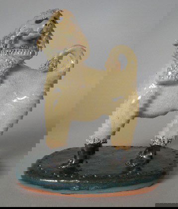 Billy Ray Hussey ceramic figurine: Billy Ray Hussey (American 1955-)- Poodle with Basket- ceramic figurine, high glaze, ca. 1989, initialed B. H. on bottom. 5 1/2''h