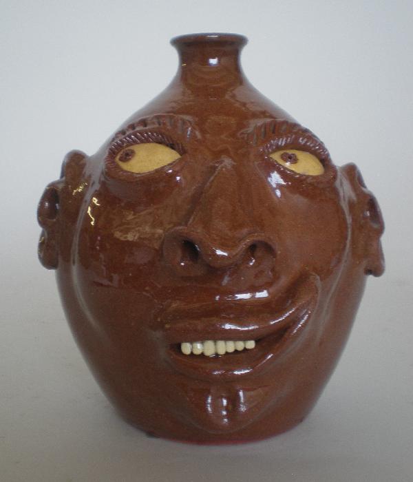Billy Ray Hussey face jug: Billy Ray Hussey (American 1955- )- Face Jug, ca. 1990, initialed B.H. on bottom. 8 1/4''h