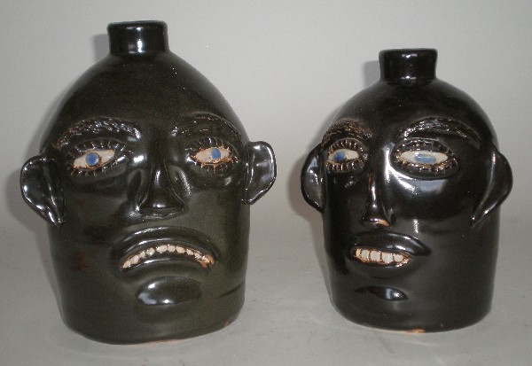 Jerry Brown 2 face jugs: Jerry Brown (American 1942- )- 2 Face Jugs, 1989, both signed, dated and inscribed 'Hamilton AL' on bottom. 10''h, 9''h