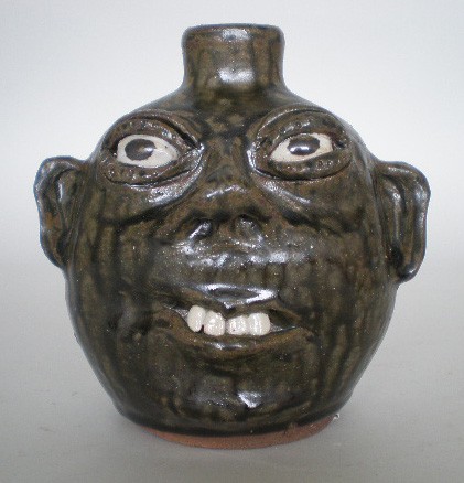 Cleater and Billie Meaders ceramic sculpture: Cleater Meaders (American 20th c.) and Billie Meaders (American 20th c.)- Face Jug- ceramic sculpture, 1990, signed and dated on bottom. 6 1/2''h