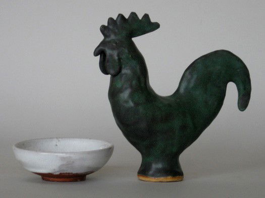 Jugtown pottery rooster: Jugtown pottery rooster by Charles Moore, dark green glaze, 1994; together with a small white dish- Rooster, signed; both are stamped Jugtown ware on bottom, bowl has repair on rim. 7''h, 1 1/2''h