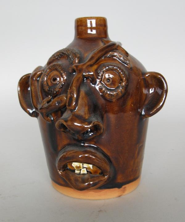 Charles Brown ceramic sculpture: Charles Brown (American 1949- )- Face Jug with Lizards- ceramic sculpture, 1990, signed 'Charlie Brown / 3-14-90 / Browns Pottery'. 8''h