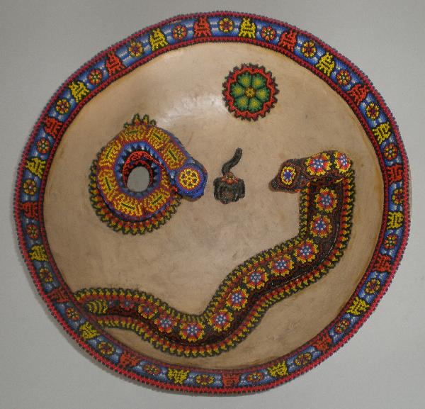 Huichol clay bowl by Luis Castro: Luis Castro- Huichol clay bowl with 2 beaded snakes and dog, signed on bottom, few areas on edge string of beads are loose, otherwise good condition. 14''dia