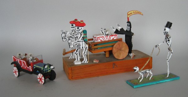 20th c. Mexican Day of The Dead figures: 20th c. Mexican Day of The Dead figures- ''Adios Corazon'', mechanical wooden funeral procession; a wooden open car with 2 skeleton figures inside; along with skeleton figure walking skeleton dog, by 