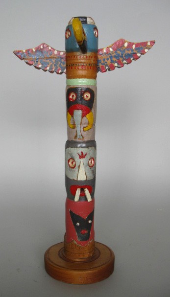20th c. American Folk Art wooden Totem: 20th c. American Folk Art- Totem- hand-carved and painted wood 3 faces with thunderbird on top. 16 1/4''