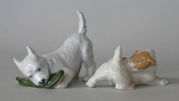 2 Royal Copenhagen porcelain figurines: 2 Royal Copenhagen porcelain figurines- White Terriers- both marked on bottom, minor tape residue on 1 Terrier, otherwise good condition. 3 1/2''h, 2''h