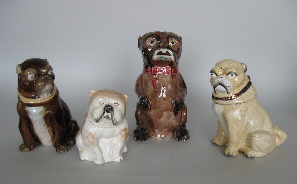 3 Staffordshire humidors and a Majolica pitcher: 20th c. 3 Staffordshire humidors- 2 Pugs, 1 Bulldog; along with a Majolica pitcher in form of Bulldog; crazing, otherwise good condition. various sizes