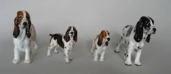 4 Royal Doulton porcelain figurines: 4 Royal Doulton porcelain figurines- 3 ''Cocker Spaniels'', HN 1036 issued 1931-85, HN 1037 issued 1931-69, and HN 1109 issued 1937-85; ''Springer Spaniel'', HN 2517, designed by Frederick Daws, issue