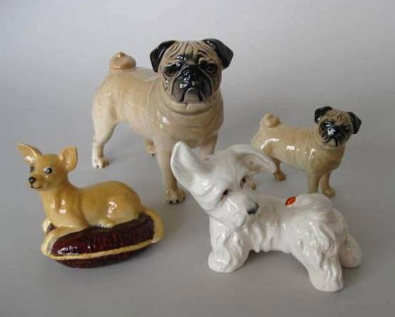 4 Beswick porcelain figurines: 4 Beswick porcelain figurines- 2 Pugs; West Highland White Terrier; Chihuahua- all marked on bottom, Westie has minor staining in ear and in back, otherwise good condition. various sizes