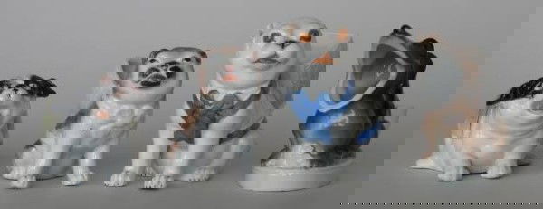 3 Porcelain match holders and 1 toothpick holder: 3 Porcelain match holders in the form of dogs; along with a Dachshund toothpick holder- good condition. various sizes