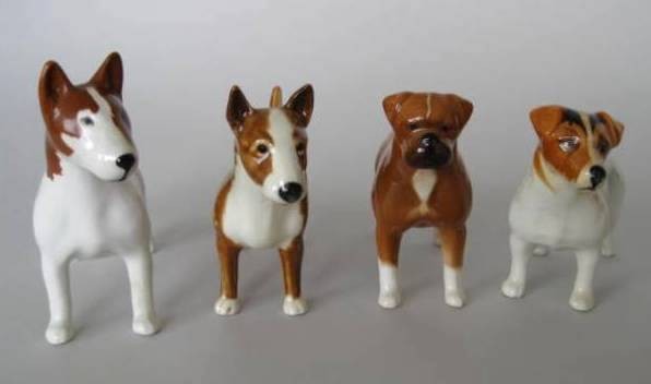4 Beswick porcelain figures: 4 Beswick porcelain figures- 2 Bull Terriers; Boxer; Jack Russel (?)- 3 stamped on bottom 'Beswick' (1 Bull Terrier not stamped), crazing in 1 Bull Terrier, otherwise good condition. various sizes