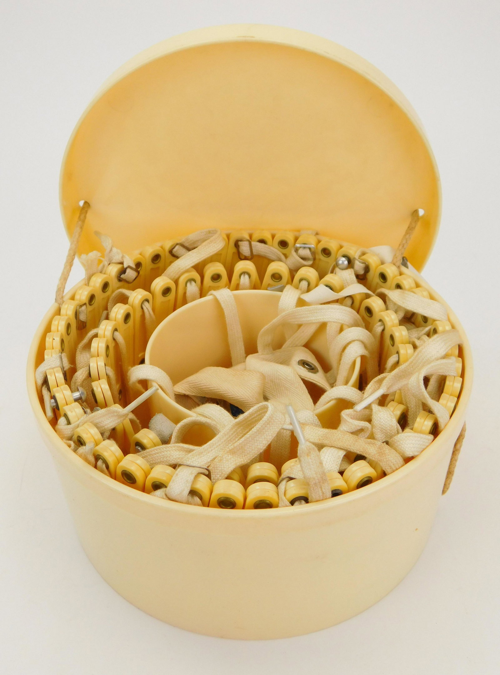 Celluloid Ivorene Hoop in box: Celluloid Ivorene skirt hoop in box, "Bell o'the Ball". Box 4'' x 8 1/2'' dia.