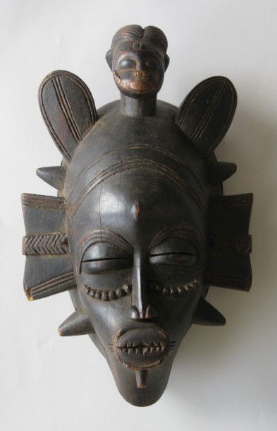 Senufo Cote d'Ivoire Face Mask: Senufo Cote d'Ivoire face mask, possibly Kpelle, wood, often used in funerary contexts, but wide variation in usage and meaning, generally good condition, slight chipping on projections on left side.
