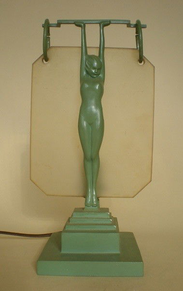 Frankart Inc. Lamp: Frankart Inc. Lamp No. L216- standing nude holds a bar that suspends a frosted amber glass plate, green with original glass bondage lamp. 15''h
