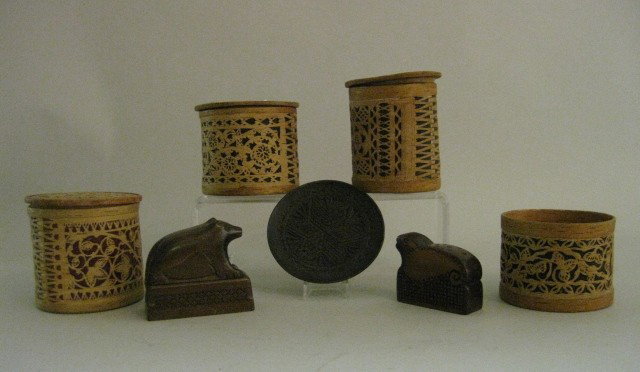 7 Russian Wooden Items: 7 20th c. Russian Wooden Items- 4 birch bark boxes, 1 missing lid; 1 bear shaped container, 1 carved seal and 1 chip carved tray. NOTE: 7 items only, instead of 8- no round wooden box