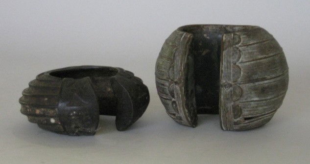 2 Senufu Cote d'Ivoire Bronze Bracelets/anklets: 2 Senufu Cote d'Ivoire Bronze Bracelets/anklets- Oversized bracelets or anklets were placed on family alters. Gaps between banded decoration were common on these hollow castings, ornamentation on one