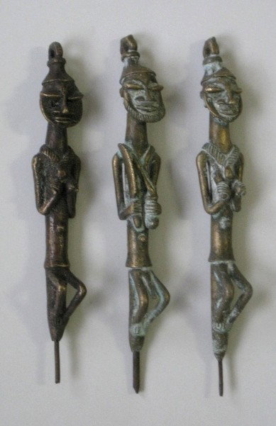 Pair of Yoruba Nigerian Edan and additional figure: Pair of Yoruba Nigerian Edan Figures and one additional Edan figure, brass and iron, staff of office for Ogboni Society, the council of elders taked with earth rituals, governance, moral enforcement a