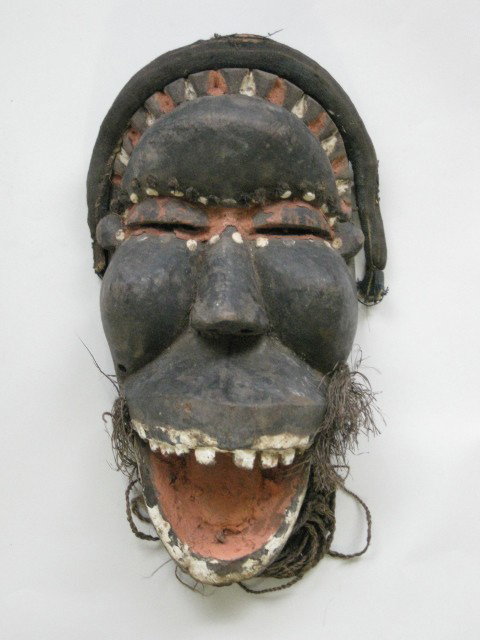 Dan or Mano Liberia and Cote d'Ivoire Go Mask: Dan or Mano Liberia and Cote d'Ivoire Go Mask with hinged jaw- wood, nails and fiber. Go Masks may visit boys during initiation. Go is associated with the Leopard Society.