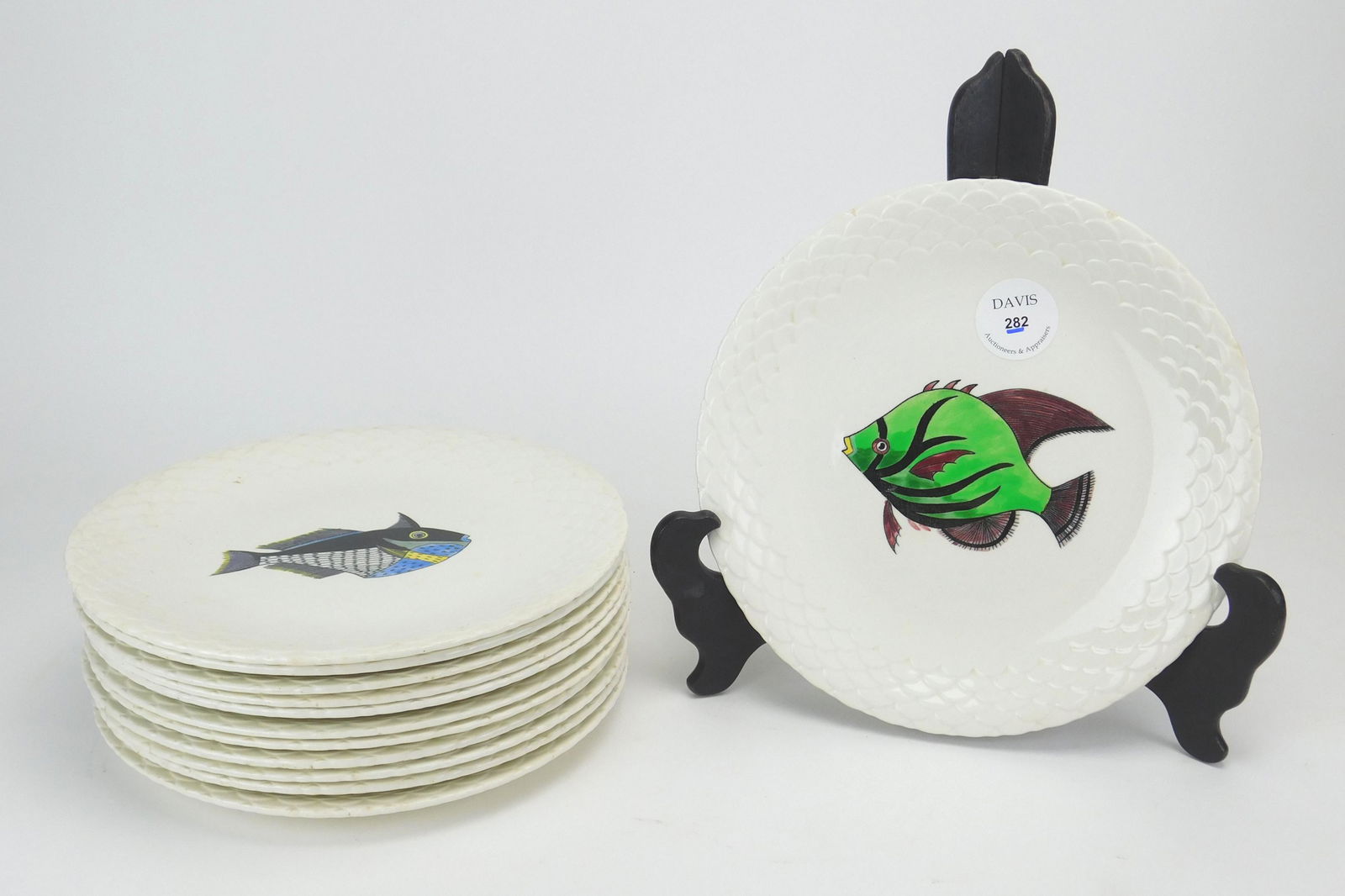 12 Gien France porcelain plates: Set of 12 Gien France porcelain plates decorated with fish designs, marks and artists initials on bottom. 10 1/4'' dia.