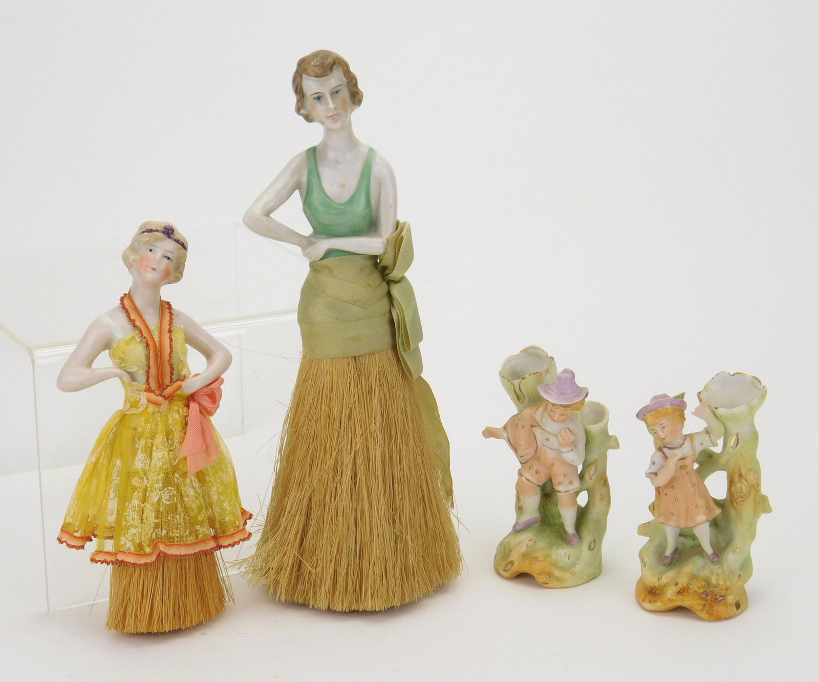 Pair of porcelain figural whisk brooms (1 of 5)