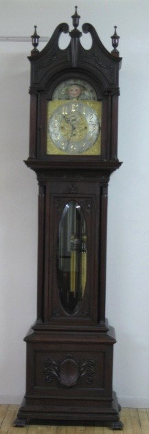 Elliot London Tall Case clock: Elliot London mahogany grandfather clock, 5 tubes and 3 wieghts, moon dial face, case is in good condition.