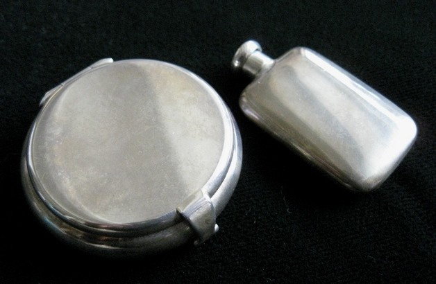 2 Tiffany & Co. Ladies accoutrements: 2 Tiffany & co. sterling silver items- pill box and a perfume vial, both marked, 1.4 oz. (English ounces)