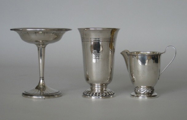 2 sterling silver items: 2 sterling silver items- 1 compote (weighted) and 1 Heirloom creamer together with a silver plate beaker, good condition.