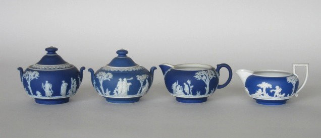 Wedgwood jasperware sugars and creamers: Wedgwood jasperware 2 sugars and 2 creamers, all with classical figures in white on a deep blue ground, marked, very good condition.