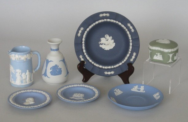 7 pcs. of Wedgwood jasperware: 7 Wedgwood jasperware items all with white classical motif, 3 plates with light blue ground; 1 ashtray with deep blue ground; 1 covered box with green ground; 1 creamer with light blue high gloss grou