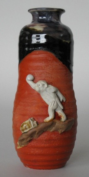 Sumida ware vase: Japanese Sumida ware vase with applied relief decoration of a monkey throwing a rock, very good condition. 6 1/2''h