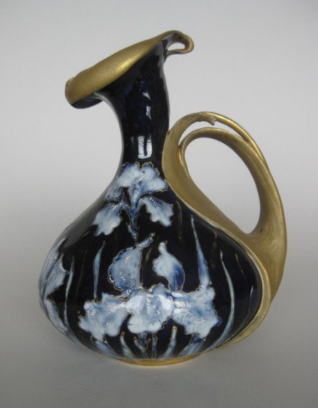 Riessner, Stellmacher & Kessel teplitz pitcher: Riessner, Stellmacher & Kessel teplitz art nouveau porcelain pitcher, iris motif on rich cobalt blue ground with gilt accents, marked on bottom, very good condition. 9''