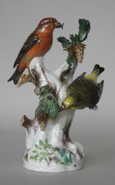 Meissen porcelain figurine: Meissen porcelain figurine- 2 crossbill birds sitting in a pine tre with pine cones, blue mark on bottom, some damage to pine neeedles. 11 1/2''h