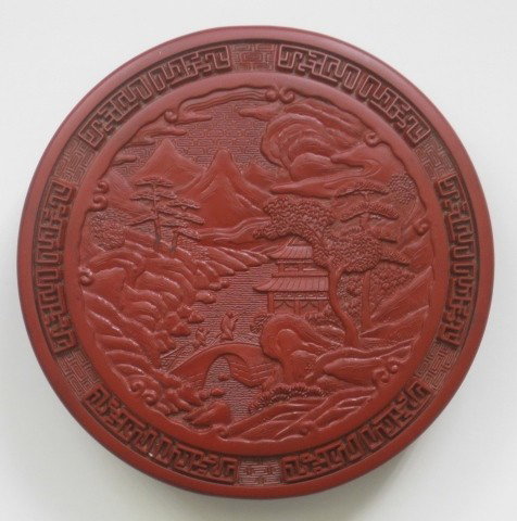 Cinnabar round carved box: Carved round cinnabar box, interior fitted for ink and brush painting, good condiiton. 5 1/2'' dia. 1 1/4''h