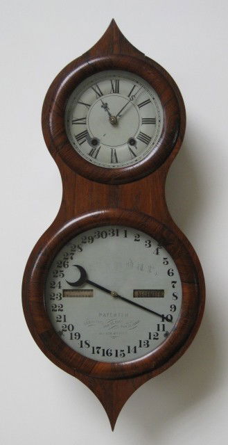19th c. Seth Thomas wall clock: Mid 19th c. Seth Thomas time and calender wall clock in rosewood case, some wear and chipping to veneer. 24 x 10 3/4''
