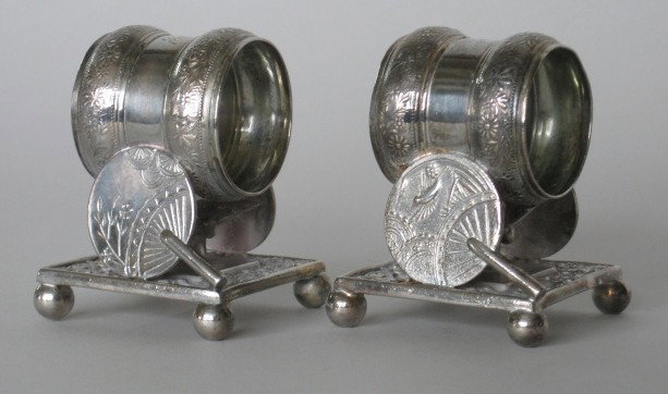 Pair of Victorian silver plate napkin rings: Pair of Meriden B. Co. Victorian silver plate napkin rings, decorated with fan motif, marked Meriden B. Co. 208, some scratches and tarnishing from use otherwise very good condition, various sizes. 2 