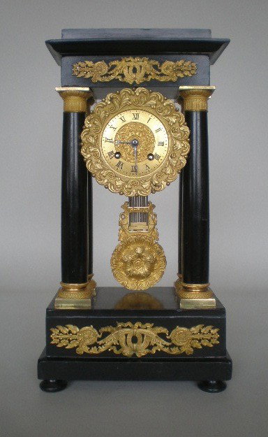 19th c. French ebonized and ormolu pillar clock: 19th c. French ebonized and ormolu pillar clock- clock works, marked 'Beaupre', several scratches and nicks, piece of wood from back side top corner missing. 15 1/2 x 5 x 8 1/4''