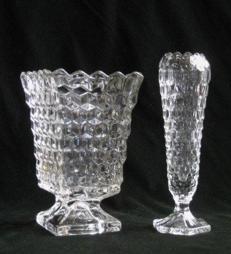 Fostoria glass square vase, etc.: Fostoria glass square vase- together with bud vase, and 2 pairs of candlesticks, all in the American pattern. 7 1/2''h, 8 1/2''h, 6 1/2''h, 3 1/2''h