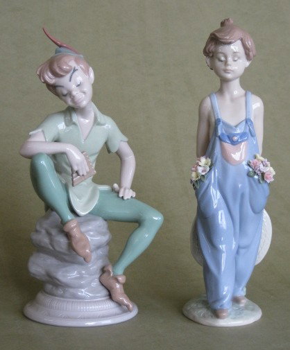2 Lladro porcelain figurines: 2 Lladro porcelain figurines- ''Peter Pan'' (1588); ''Girl Holding Hat'' (7650)- both marked on bottom, very good condition. 10''h ea.