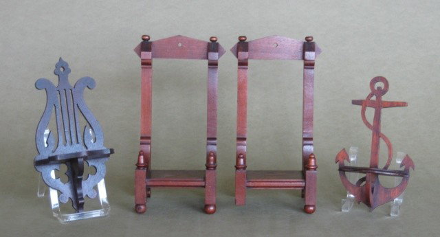 Pair of Table top display stands: Pair of Table top display stands-1 missing a foot, together with 2 hanging wall shelves, lyre form and anchor form.